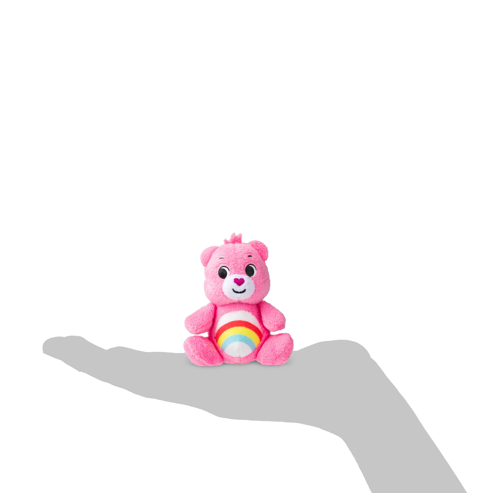 Rainbow bear in the image of a hand to show the small scale.
