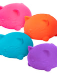 A pink, orange, blue and purple Teenie Cool Cat Nee Dog toy
