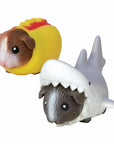 Two Guinea Pig toys, one in a hot dog outfit, the other in a shark